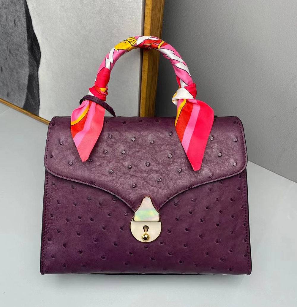 Borsa con manico superiore in vera pelle di struzzo viola