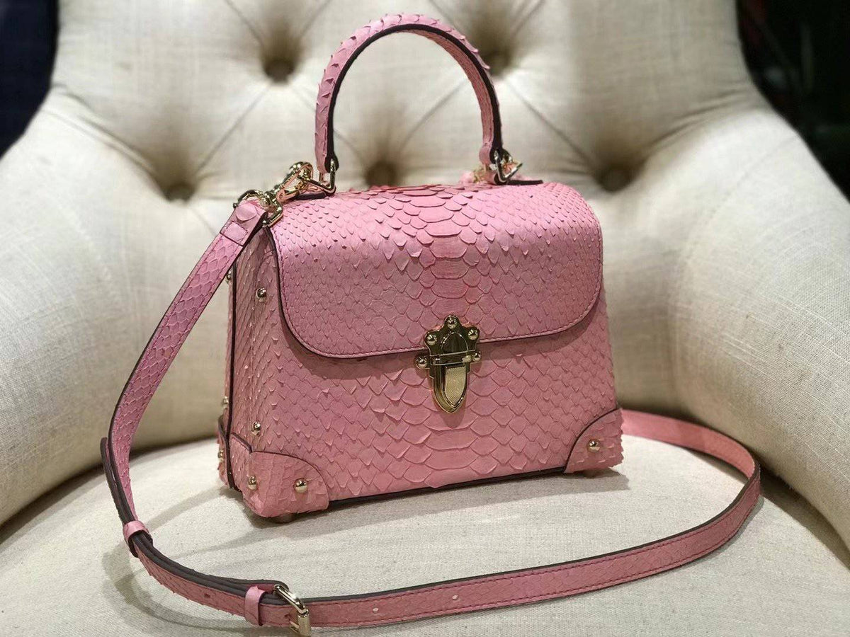 Mini borsa a tracolla con manico superiore in pelle effetto python e rivetti, rosa