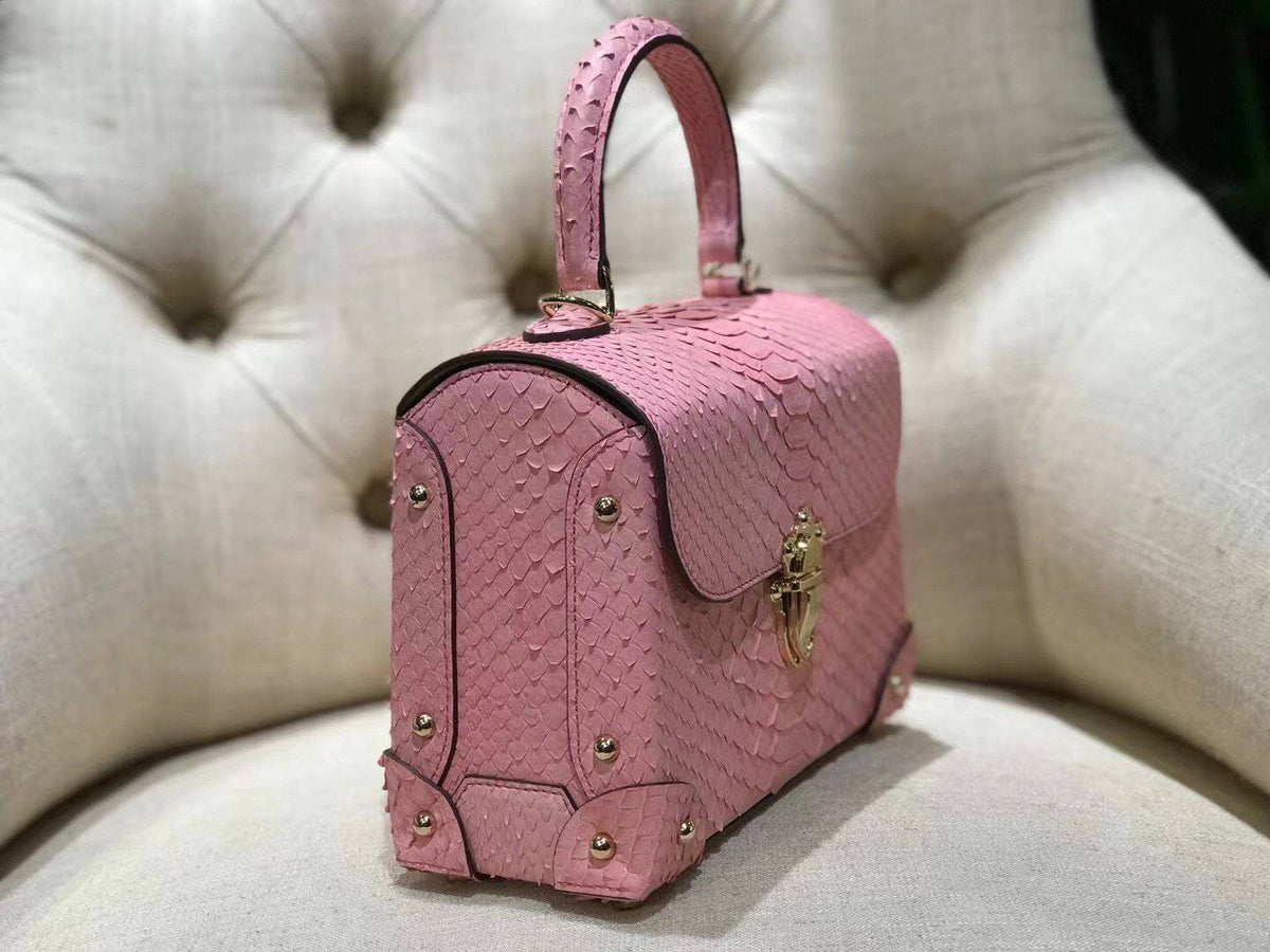 Mini borsa a tracolla con manico superiore in pelle effetto pitone e rivetti, rosa